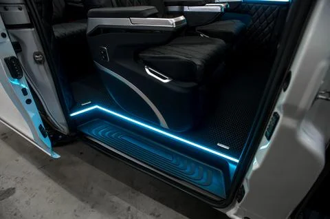 Comfortable interior of a passenger bus with soft seats Stock Photos
