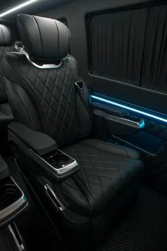 Comfortable interior of a passenger bus with soft seats Stock-Fotos