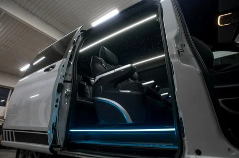 Comfortable interior of a passenger bus with soft seats Stock Photos