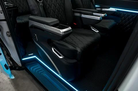 Comfortable interior of a passenger bus with soft seats Stock-Fotos