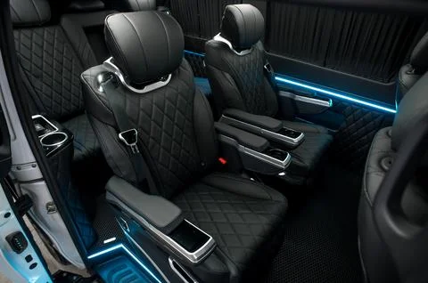 Comfortable interior of a passenger bus with soft seats Stock Photos
