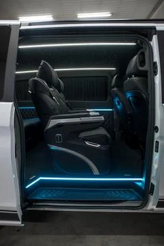 Comfortable interior of a passenger bus with soft seats Stock Photos