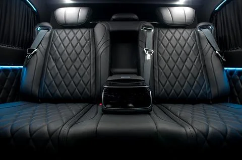 Comfortable interior of a passenger bus with soft seats Stock-Fotos