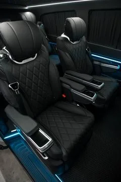 Comfortable interior of a passenger bus with soft seats Stock-Fotos