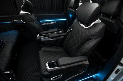Comfortable interior of a passenger bus with soft seats Stock Photos