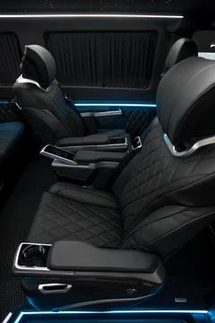 Comfortable interior of a passenger bus with soft seats Stock Photos