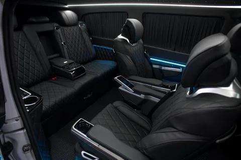 Comfortable interior of a passenger bus with soft seats Stock-Fotos