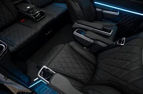 Comfortable interior of a passenger bus with soft seats Stock-Fotos