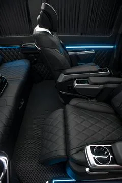 Comfortable interior of a passenger bus with soft seats Stock-Fotos