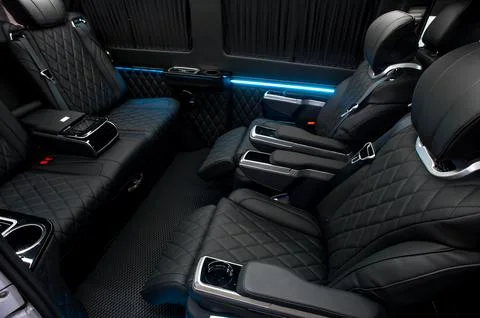Comfortable interior of a passenger bus with soft seats Stock-Fotos