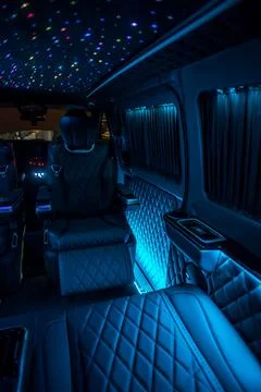 Comfortable interior of a passenger bus with soft seats Stock Photos