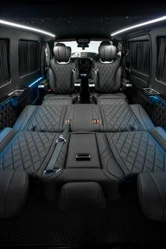 Comfortable interior of a passenger bus with soft seats Stock-Fotos