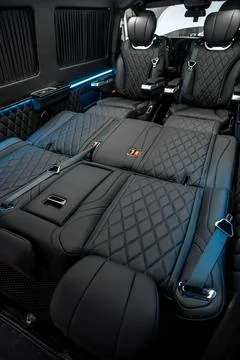 Comfortable interior of a passenger bus with soft seats Stock Photos