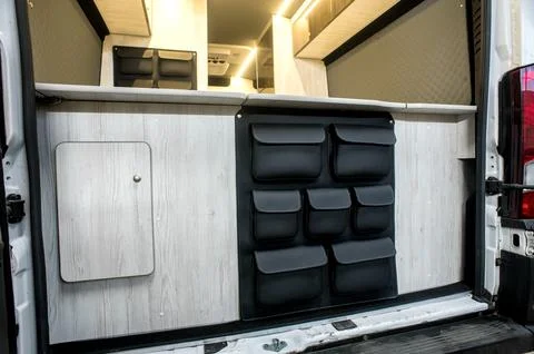 Comfortable interior of a passenger bus with soft seats Stock Photos