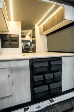 Comfortable interior of a passenger bus with soft seats Stock Photos