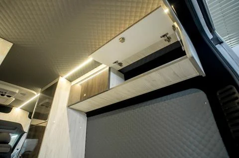Comfortable interior of a passenger bus with soft seats Stock-Fotos