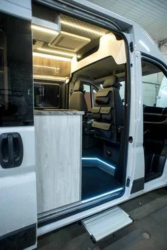Comfortable interior of a passenger bus with soft seats Stock Photos