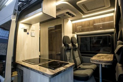 Comfortable interior of a passenger bus with soft seats Stock-Fotos