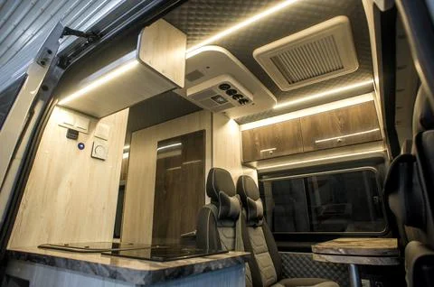 Comfortable interior of a passenger bus with soft seats Stock Photos