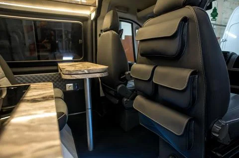 Comfortable interior of a passenger bus with soft seats Stock Photos