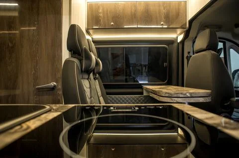Comfortable interior of a passenger bus with soft seats Stock Photos