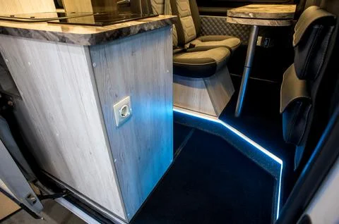Comfortable interior of a passenger bus with soft seats Stock Photos