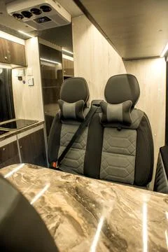 Comfortable interior of a passenger bus with soft seats Stock-Fotos