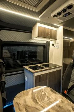 Comfortable interior of a passenger bus with soft seats Stock Photos