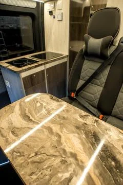 Comfortable interior of a passenger bus with soft seats Stock Photos