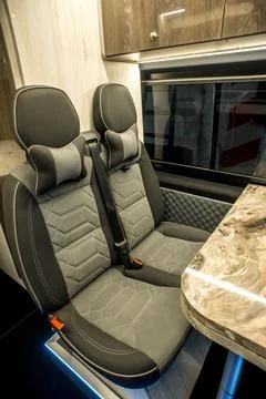 Comfortable interior of a passenger bus with soft seats Stock-Fotos