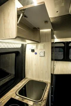 Comfortable interior of a passenger bus with soft seats Stock Photos