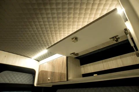 Comfortable interior of a passenger bus with soft seats Stock Photos