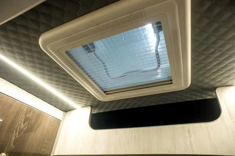 Comfortable interior of a passenger bus with soft seats Stock Photos