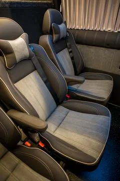 Comfortable interior of a passenger bus with soft seats Stock-Fotos