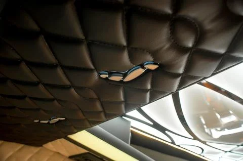 Comfortable interior of a passenger bus with soft seats Stock Photos