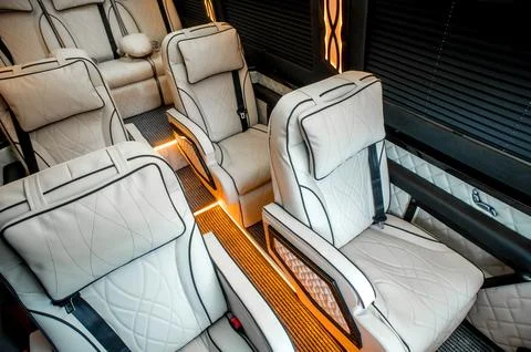 Comfortable interior of a passenger bus with soft seats Stock-Fotos