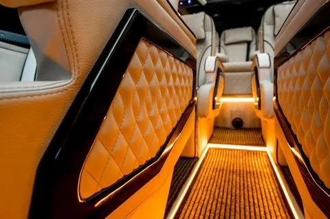 Comfortable interior of a passenger bus with soft seats Stock-Fotos