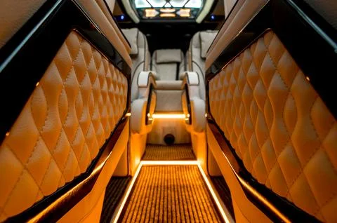 Comfortable interior of a passenger bus with soft seats Stock Photos