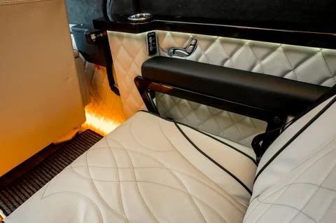 Comfortable interior of a passenger bus with soft seats Stock Photos