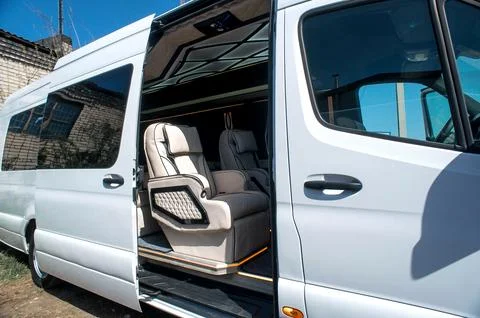 Comfortable interior of a passenger bus with soft seats 스톡 사진