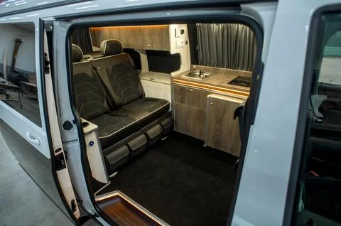 Comfortable interior of a passenger bus with soft seats Stock-Fotos
