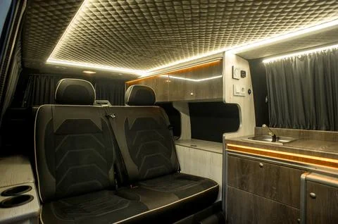 Comfortable interior of a passenger bus with soft seats Stock Photos