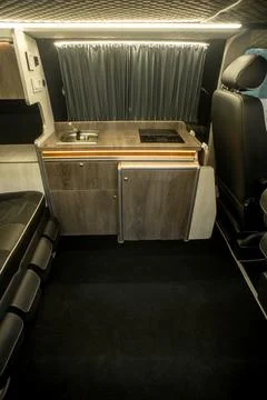 Comfortable interior of a passenger bus with soft seats Stock Photos