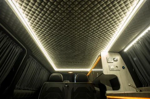 Comfortable interior of a passenger bus with soft seats Stock Photos