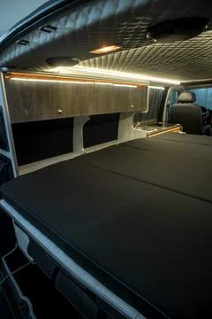Comfortable interior of a passenger bus with soft seats Stock Photos