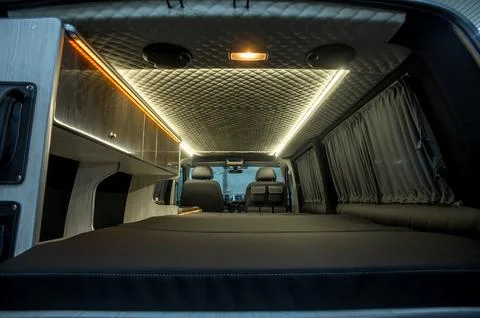 Comfortable interior of a passenger bus with soft seats Stock Photos