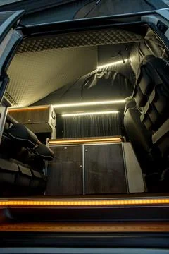 Comfortable interior of a passenger bus with soft seats Stock Photos