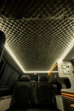 Comfortable interior of a passenger bus with soft seats Stock Photos