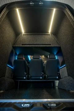 Comfortable interior of a passenger bus with soft seats Foto stock