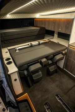 Comfortable interior of a passenger bus with soft seats Stock Photos